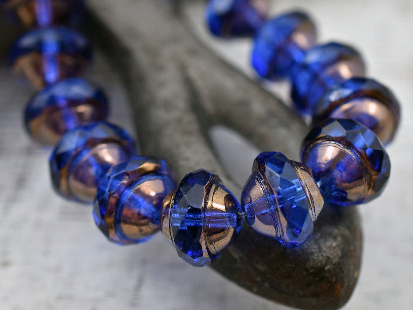 *12* 10x12mm Bronze Washed Sapphire Saturn Beads