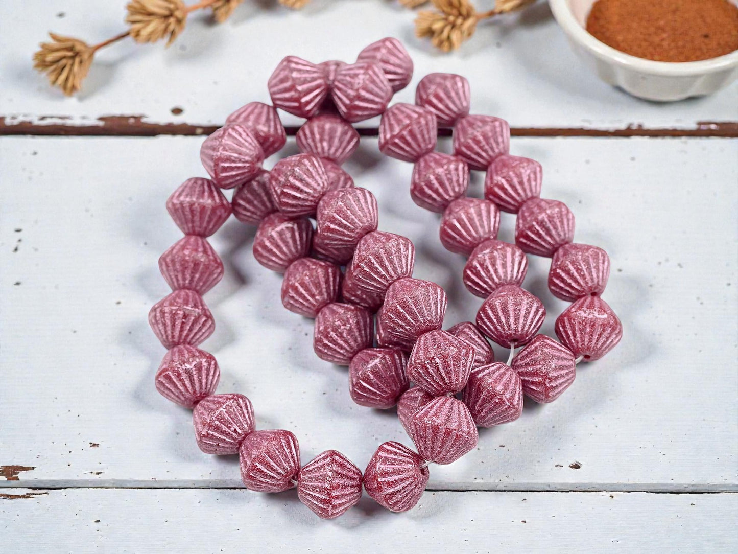 *15* 11mm Metallic Pink Washed Etched Rosewood Carved Bicone Beads
