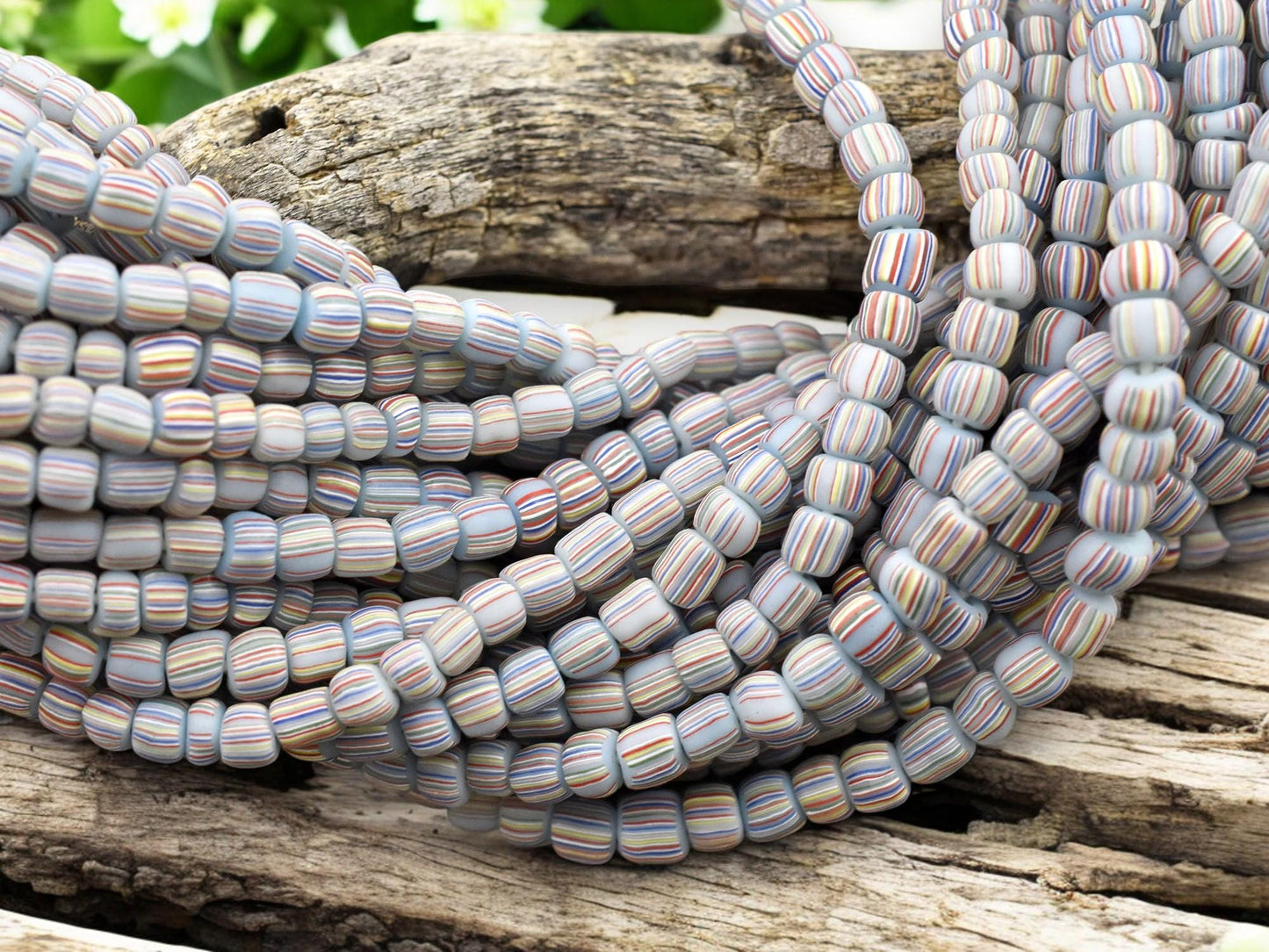 Striped Java Glass Beads. 4-7mm beads. Approx 24" Strands. 6-7 beads per inch.
