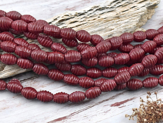 *21* 6x9mm Opaque Red Grooved Oval Beads