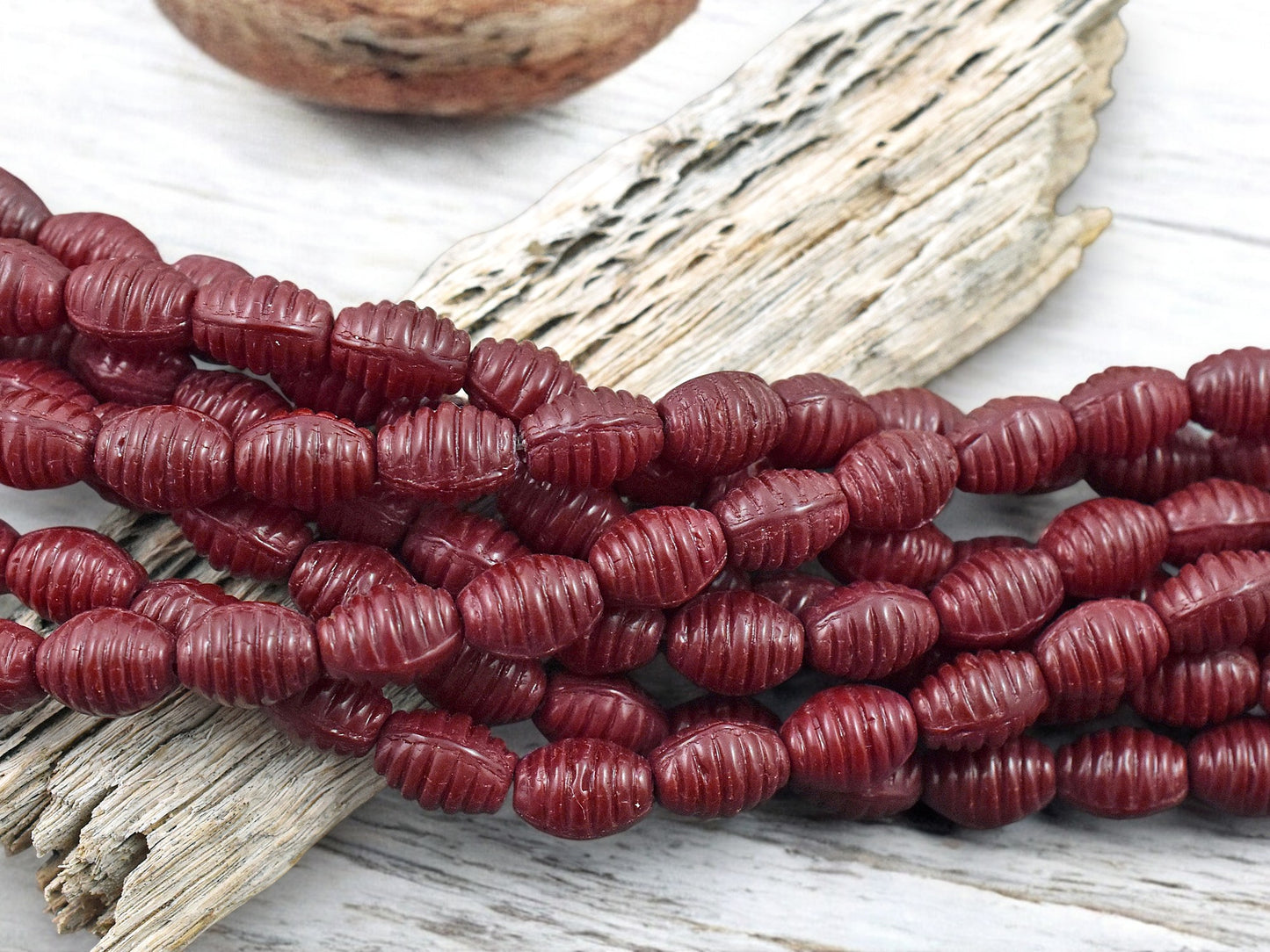 *21* 6x9mm Opaque Red Grooved Oval Beads