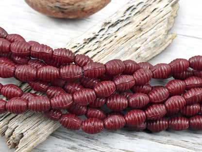 *21* 6x9mm Opaque Red Grooved Oval Beads