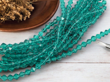 *25* 6mm Tranclucent Teal Lucerna Bicone Beads