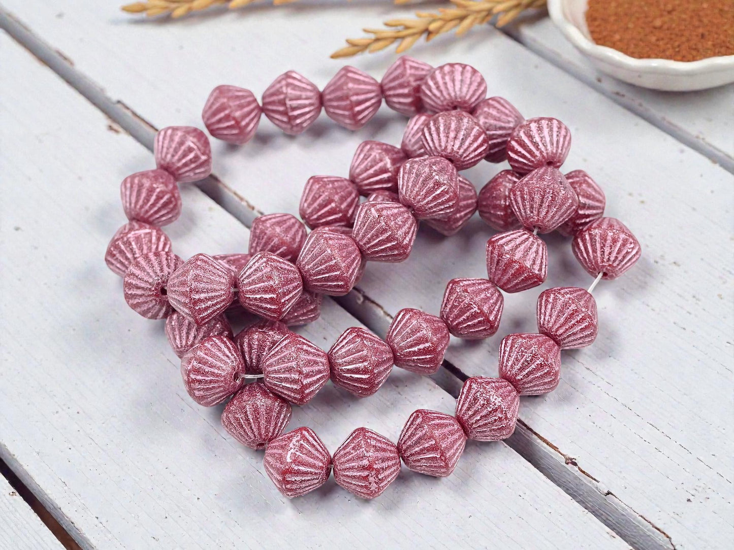 *15* 11mm Metallic Pink Washed Etched Rosewood Carved Bicone Beads