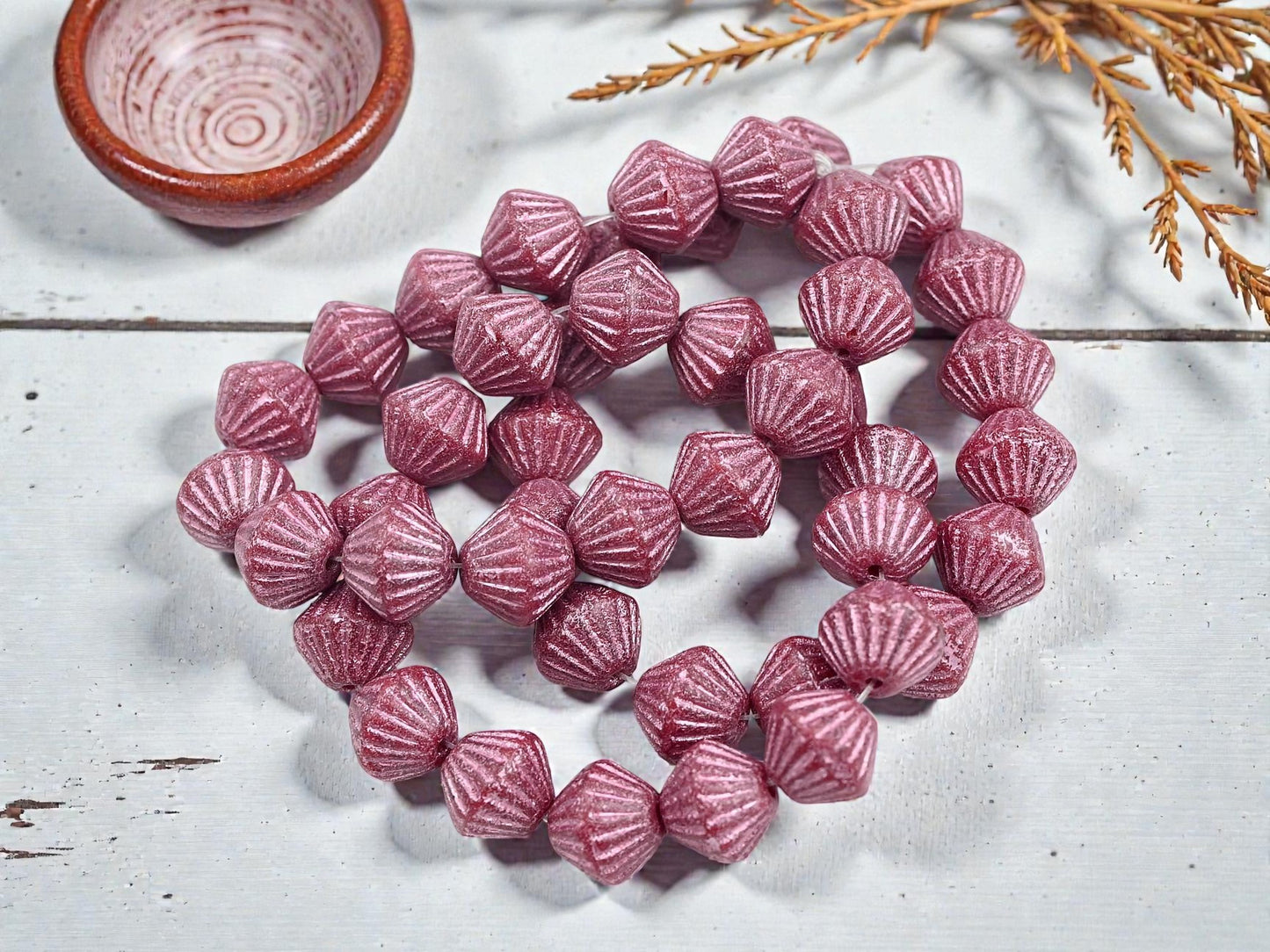 *15* 11mm Metallic Pink Washed Etched Rosewood Carved Bicone Beads