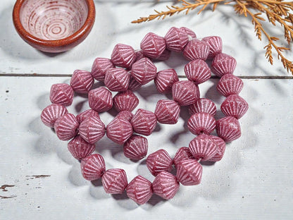 *15* 11mm Metallic Pink Washed Etched Rosewood Carved Bicone Beads