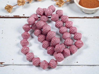 *15* 11mm Metallic Pink Washed Etched Rosewood Carved Bicone Beads