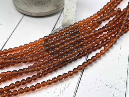*34* 6mm Root Beer Topaz Round Druk Beads