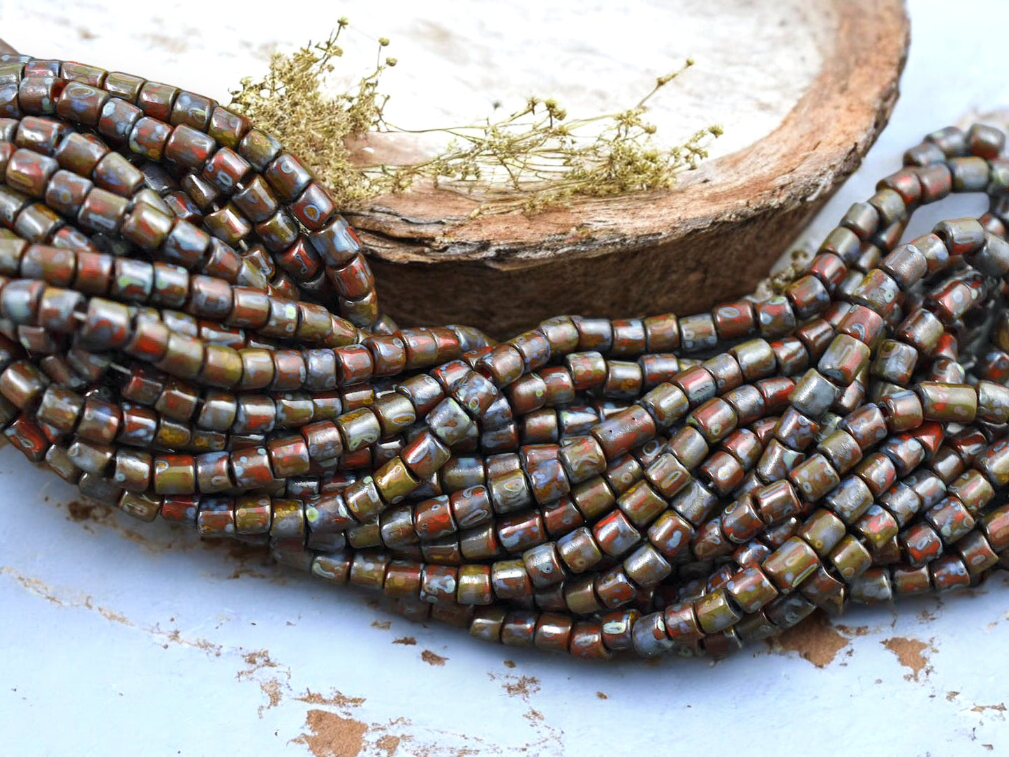 6/0 Aged Dark Red Picasso Bugle Tube Seed Bead Mix (21" Strand)