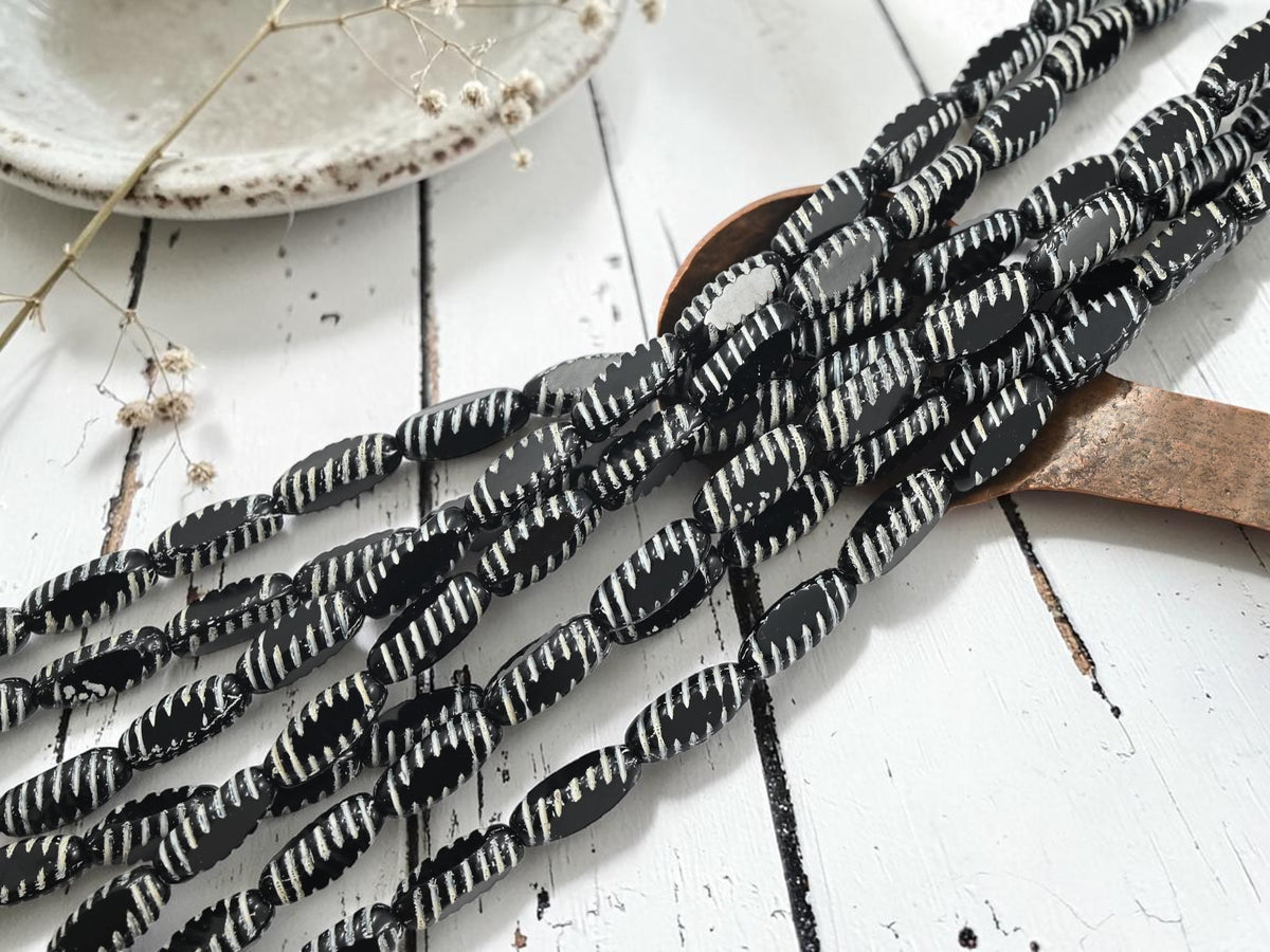 *14* 14x6mm White Washed Jet Black Table Cut Oval Beads