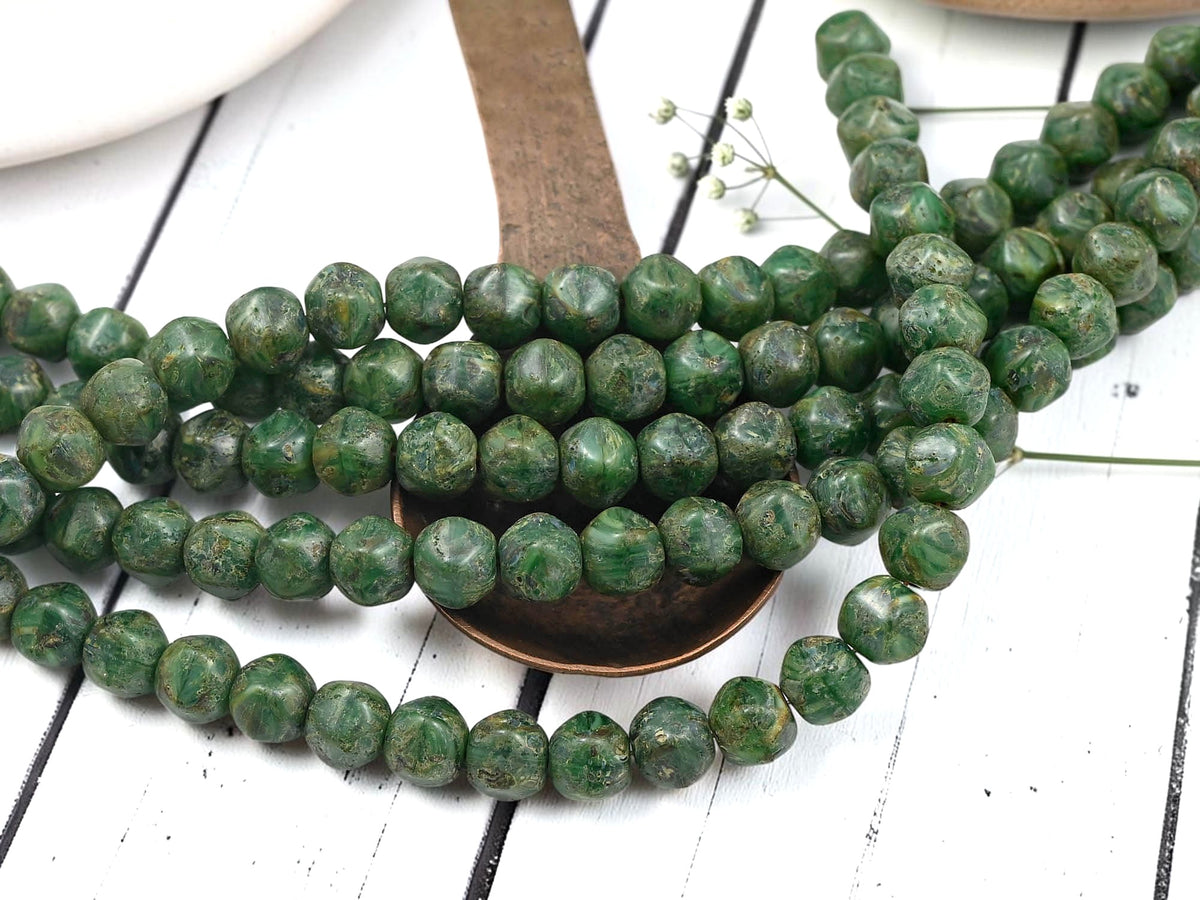 *26* 8x7mm Rustic Dark Green Picasso Dented Round Beads