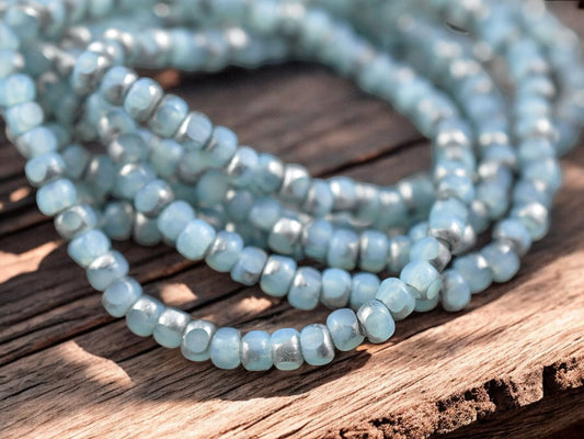 *50* 4x3mm Silver Washed Etched Matte Sky Blue Trica Beads