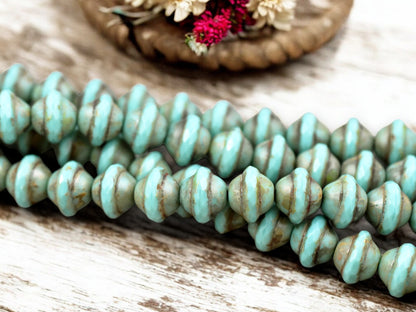 *15* 9x11mm Opaque Turquoise Picasso Saturn Beads