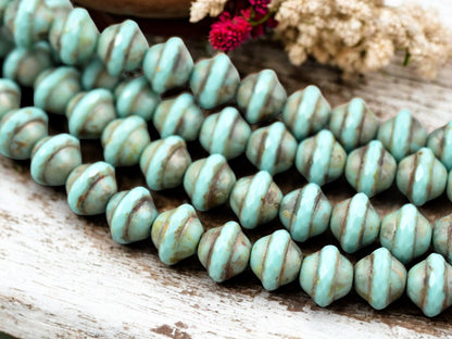 *15* 9x11mm Opaque Turquoise Picasso Saturn Beads