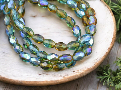 *20* 5x7mm Teal Topaz AB Fire Polished Faceted Oval Beads