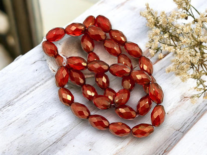 *12* 12x8mm Gold Lustered Ruby Red Fire Polished Faceted Oval Beads