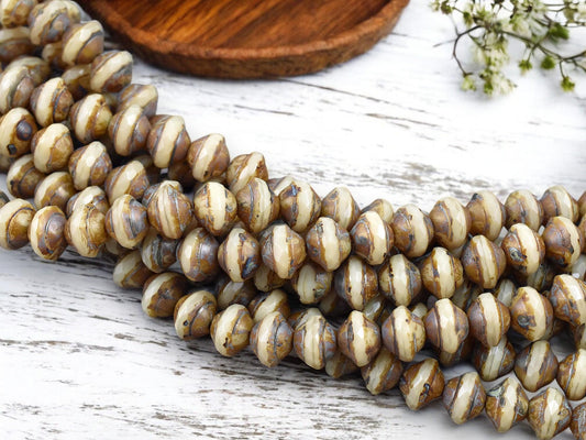 *27* 7x9mm Opaque Beige Picasso Saturn Beads