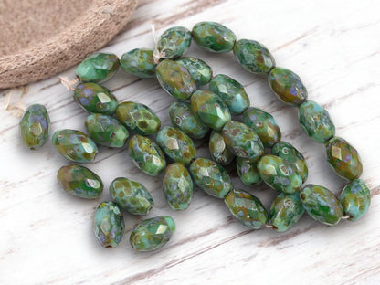 *12* 12x8mm Mottled Turquoise Picasso Fire Polished Faceted Oval Beads