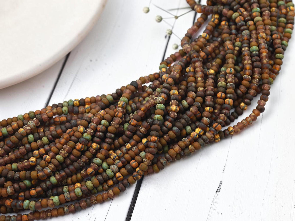 Size 6/0 Aged Matte Picasso Seed Bead Strands - Matte Druid Striped Picasso Mix - 20" Strand - (A412)
