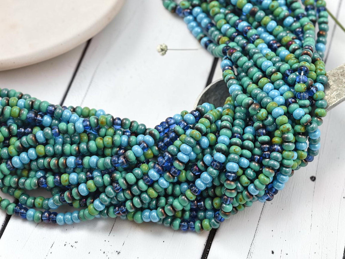 Size 6/0 Aged Picasso Seed Bead Strands - Tessarion Blue Picasso Mix - 19" Strand - (B114)