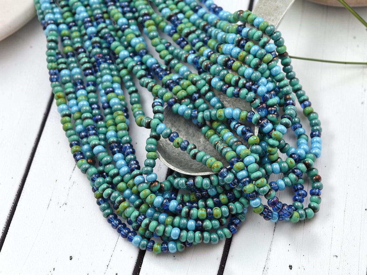 Size 6/0 Aged Picasso Seed Bead Strands - Tessarion Blue Picasso Mix - 19" Strand - (B114)