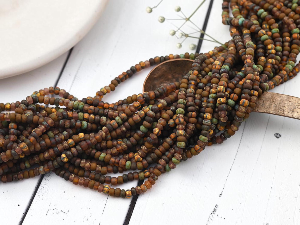 Size 6/0 Aged Matte Picasso Seed Bead Strands - Matte Druid Striped Picasso Mix - 20" Strand - (A412)