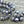 Load image into Gallery viewer, 8x10mm White Silver Washed Violet Purple AB Saturn Beads
