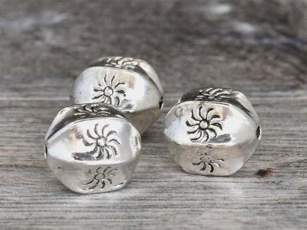 *10* 11x9mm Antique Silver Wedged Rounds w/Sun Design