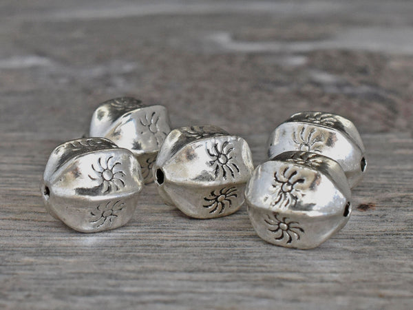 *10* 11x9mm Antique Silver Wedged Rounds w/Sun Design